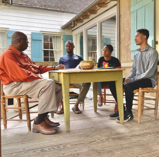 Photo of people talking around a table